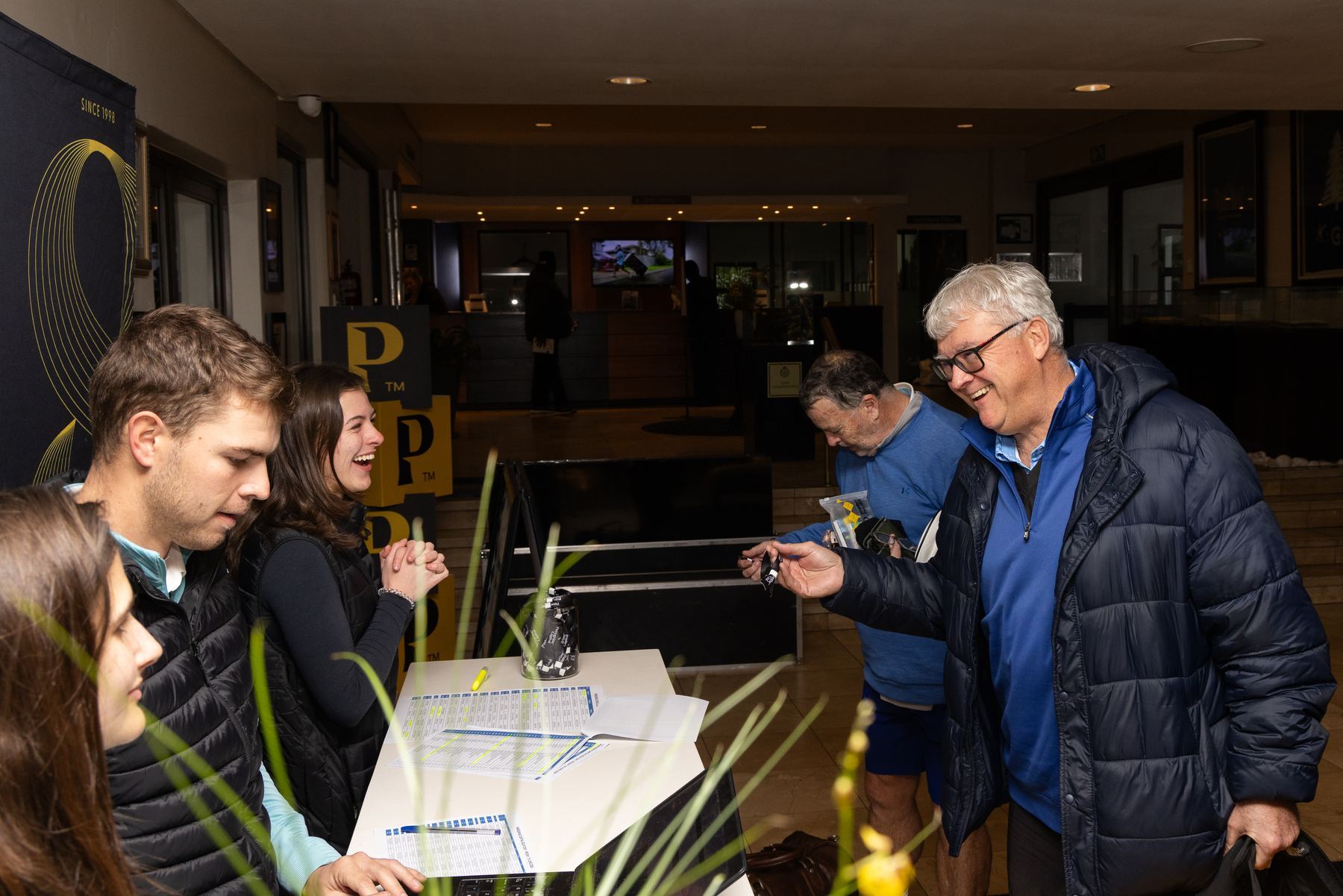 StuSta staff checking in guests at a registration desk