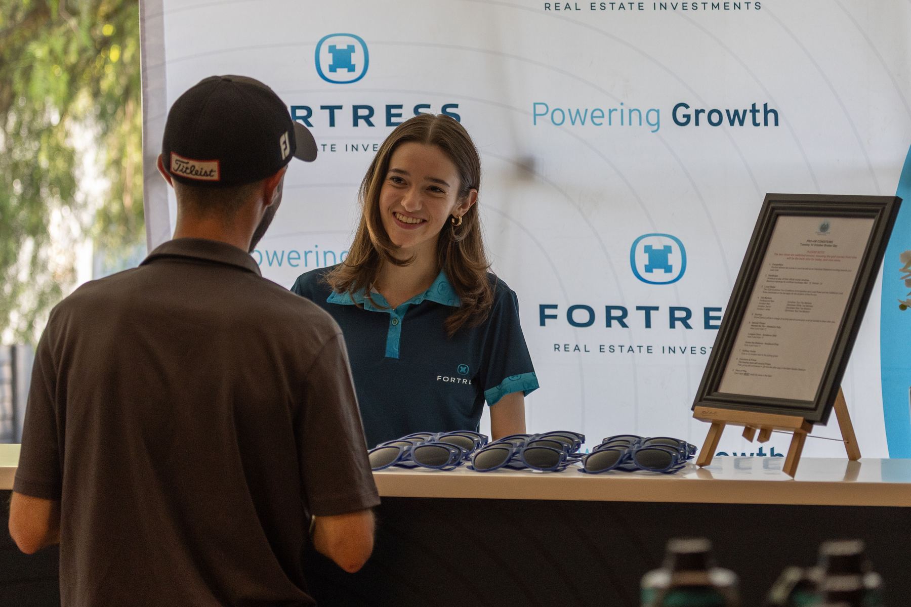 StuSta staff member welcoming a guest at a corporate desk